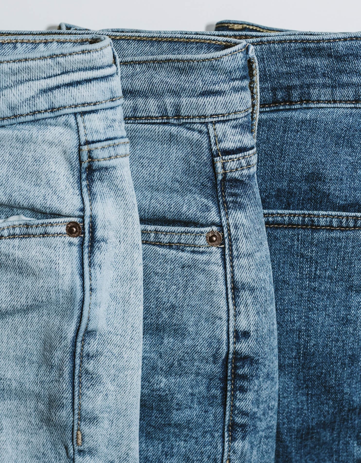Three pairs of blue jeans